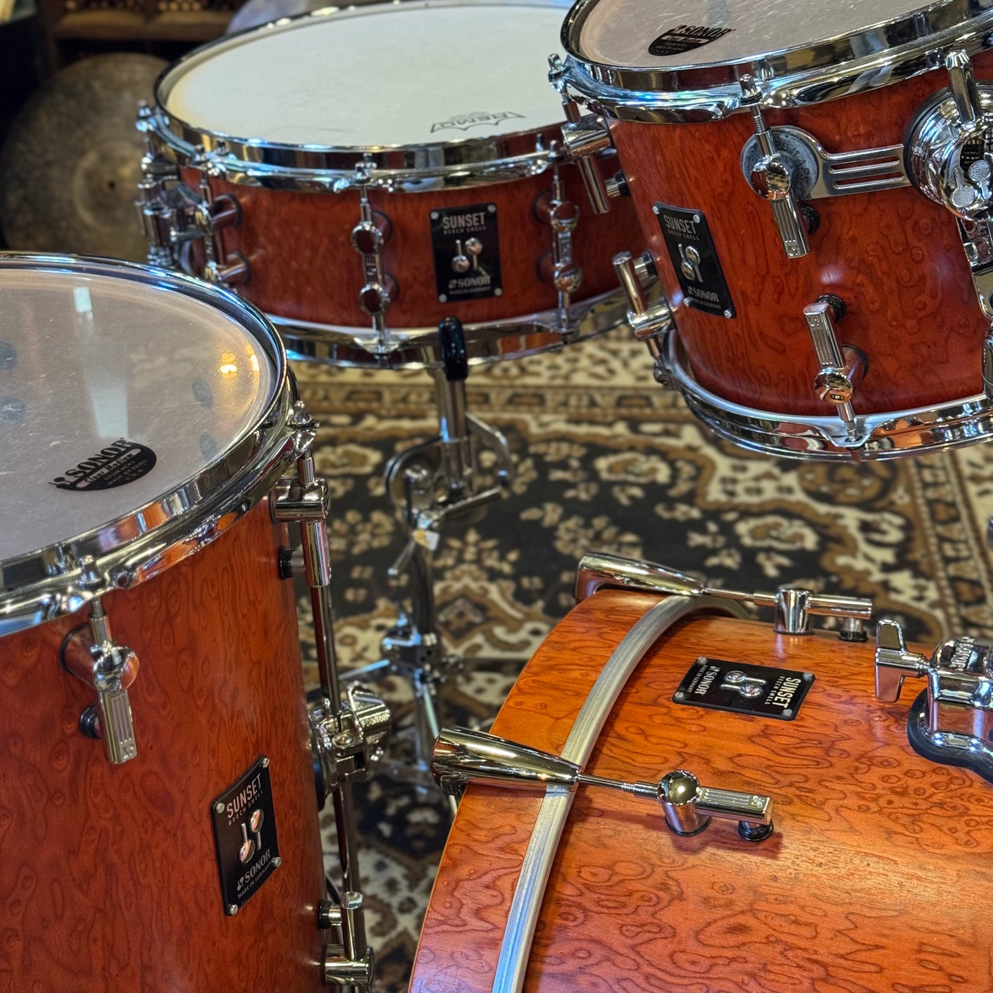 USED Sonor Sunset Beech Limited Edition Drum Set in Transparent Red Birdseye Maple Veneer - 14x18, 8x12, 14x14
