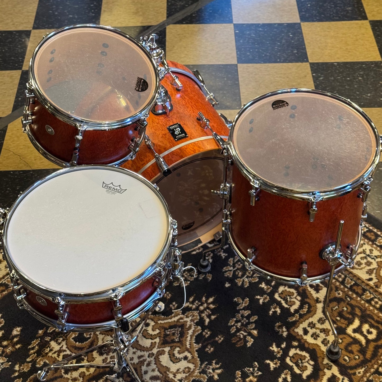 USED Sonor Sunset Beech Limited Edition Drum Set in Transparent Red Birdseye Maple Veneer - 14x18, 8x12, 14x14