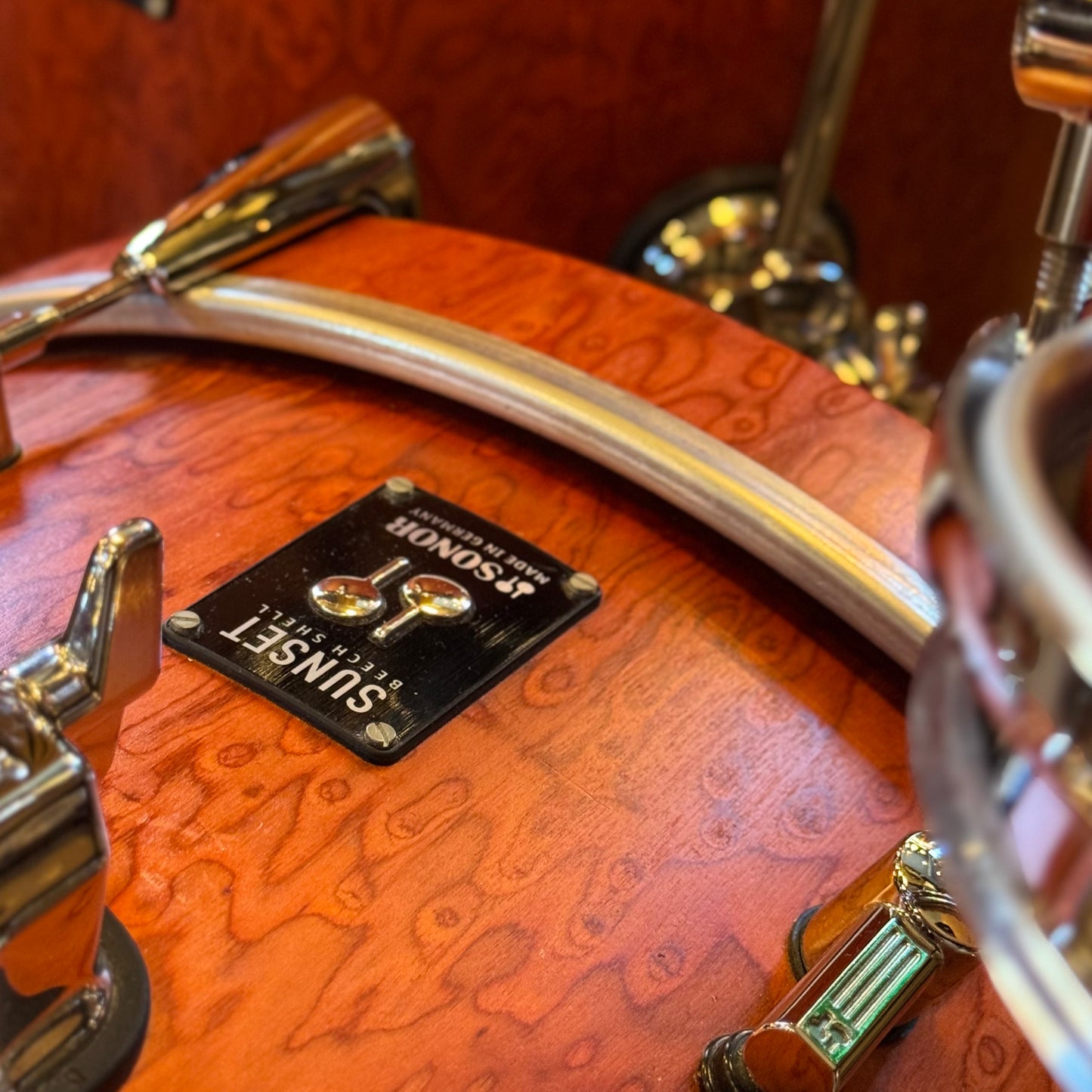 USED Sonor Sunset Beech Limited Edition Drum Set in Transparent Red Birdseye Maple Veneer - 14x18, 8x12, 14x14